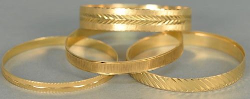 Five 18K gold bracelets. 
77.9 grams