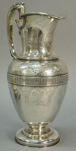 Large Tiffany sterling silver ewer having hand chased and engraved classical design, made by John C. Moore, marked on bottom: