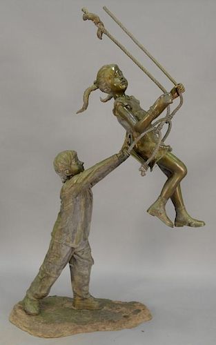 Bronze figure of boy pushing girl on swing, late 20th century.  ht. 76in., wd. 20in., dp. 44in.