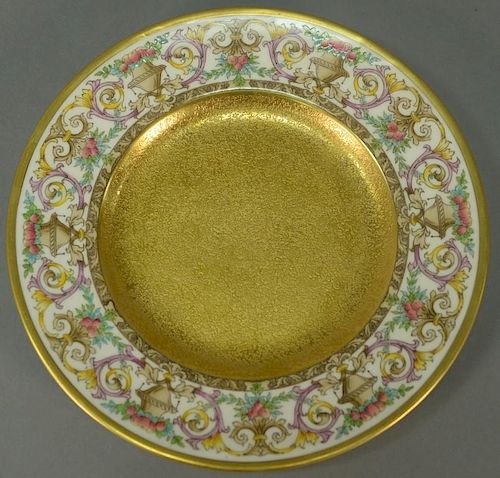 Set of twelve Minton luncheon plates with encrusted gold center and fruit basket border. 
dia. 9 in.