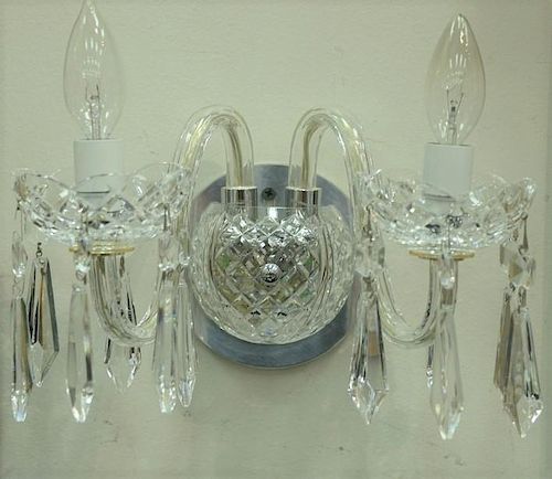 Set of three Waterford crystal double arm wall sconces with prisms.  ht. 15in., wd. 13in.