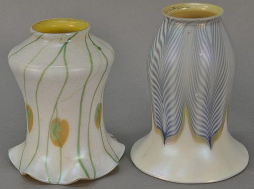 Two Quezal art glass shades, one signed Quezal white with blue pulled feather design and the other white having vine and leaf