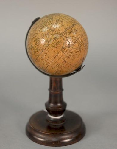 Table globe on turned wood shaft and foot, 19th century. 
ht. 6in., dia. 3in.