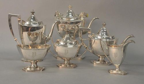 Six piece sterling silver tea and coffee set with tilting pot, coffee pot, teapot, sugar, creamer, and waste bowl. 
ht. 3 3/4