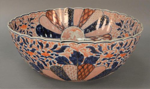 Imari porcelain punch bowl with ruffled edge.  (5inch crack from top)  ht. 7 1/2in., dia. 19in.
