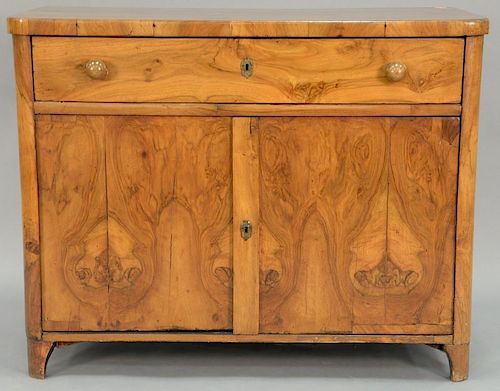 Biedermeier style cabinet with one long drawer over two doors all set on plain feet, late 18th century to early 19th century.
