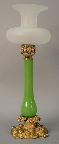 French green opaline glass oil lamp with frosted shade, Palmer London. ht. 21 1/2in.