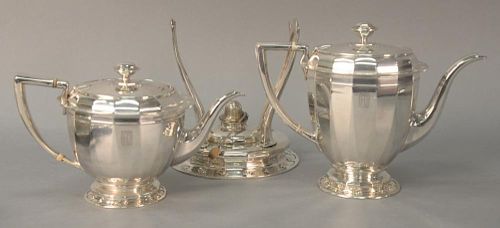 Three piece Tiffany & Co. sterling silver including "St. Dunstan" pattern tea pot and coffee pot, and a stand for kettle mark