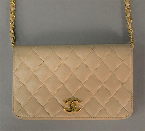 Chanel quilted beige leather purse with front flap with dust bag.  ht. 4 1/2in., lg. 7 1/2in.