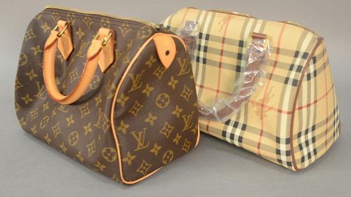 Two purses to include Louis Vuitton Speedy 25 monogram handbag and new Burberry London handbag with tag and plastic. 
Louis V
