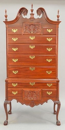 Fineberg mahogany Chippendale style highboy in two parts, upper portion with broken arch top over three over four drawers on 