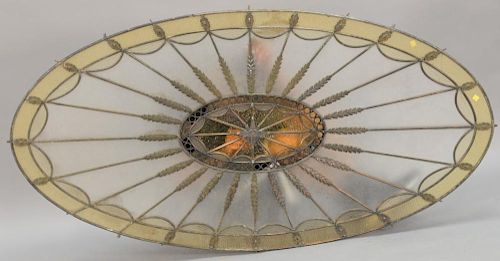 Pair of large oval architectural stained glass roof panels or windows with oval insert. 
36" x 70" each