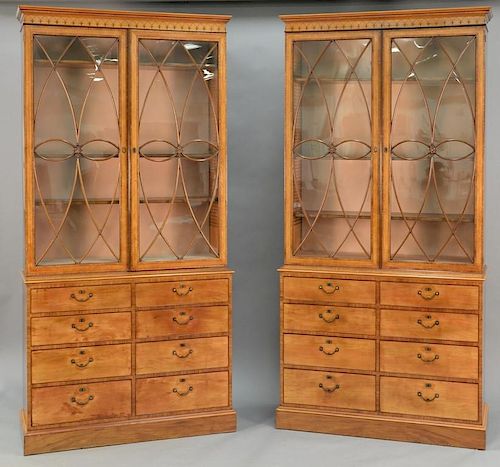 Pair of George III satinwood and tulipwood marquetry bookcase cabinets in two parts, upper portion with cornice molded top ov