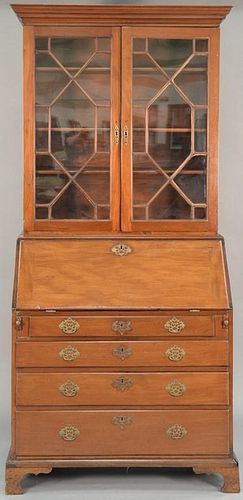 George II mahogany secretary desk in two parts, upper portion with cornice molding over glazed doors on lower section with sl