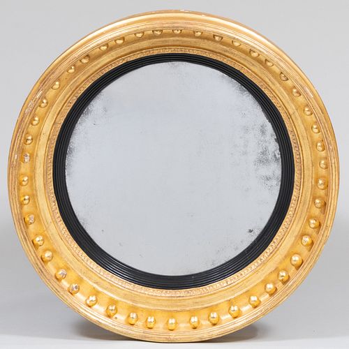 Regency Carved Giltwood and Ebonized Convex Mirror