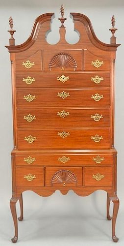 Margolis mahogany highboy in two parts having a full bonnet top with three finials over three short drawers over four long dr