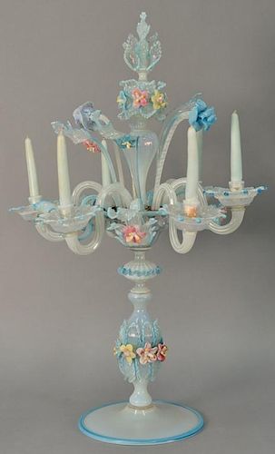Venetian glass candelabra having multi-color six candle arms and floral and leaf decorations, all set on pedestal with round 