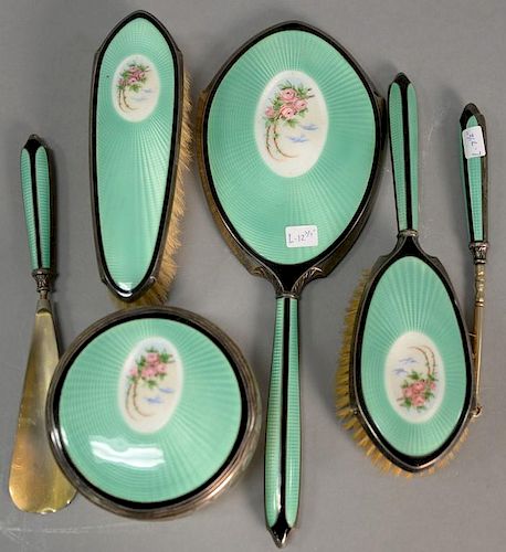 Foster & Bailey sterling silver enameled six piece dresser set, green with flower center marked F+B Sterling. 
mirror: lg. 12
