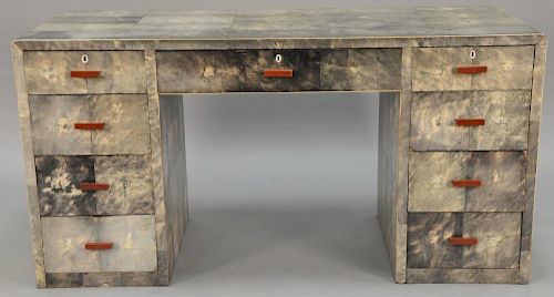 Art Deco shagreen kneehole desk having rectangular rounded top over long center drawer flanked by four drawers on each side, 