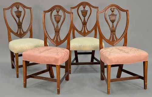 Set of four Margolis State House style side chairs each with carved urn and shield back and fully upholstered serpentine seat