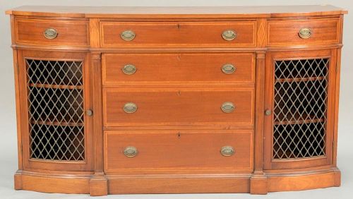 Margolis mahogany credenza, D shaped with three drawers over open center over center drawer flanked by grill work doors. ht. 
