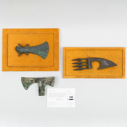 Two Framed Luristan Bronze Axe Heads together with a Luristan Bronze Double Axe Head