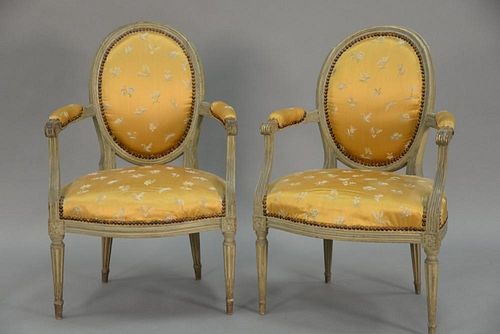 Pair of Louis XVI style fauteuil in silk upholstery and grey paint, probably 19th century.  ht. 35 1/4in., wd. 23 1/2in.