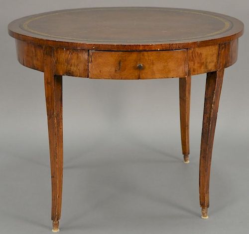 George III mahogany center table with leather top and one drawer, early 19th century. ht. 28in., dia. 25 1/2in.