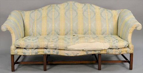 George II sofa having shaped camel back and rolled arms with serpentine front rail on molded front legs with stretcher base a