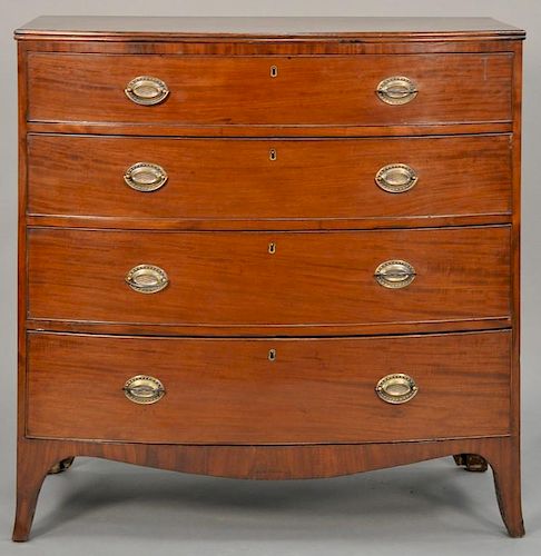 English mahogany bow front chest having rectangular top over four long graduated drawers on flared French feet.  ht. 41in., w
