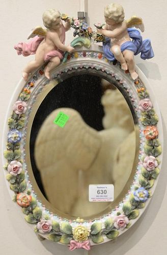 Pair of German porcelain framed mirrors, each with putti on top.  (some repairs)  ht. 14in., wd. 9 1/2in.