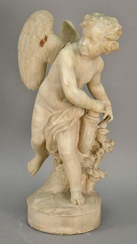 Carved alabaster figure of cupid grabbing his arrow, signed Houry. ht. 27in., wd. 11in., dia. of base 9in.