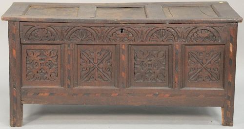 Oak lift top blanket chest with carved panel front, 17th century. 
ht. 26in., wd. 54 1/2in., dp. 20in.