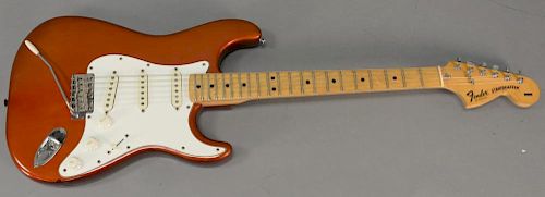 1979 Fender Stratocaster with tremelo bar in original candy apple red with hard shell case, serial number S964365. 
lg. 39in.