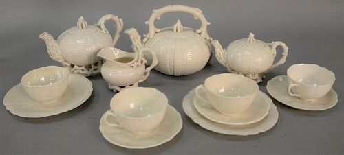 Thirteen piece Belleek teaset service to include teapot, coffee pot, sugar, creamer, four cups, three saucers, and two dishes