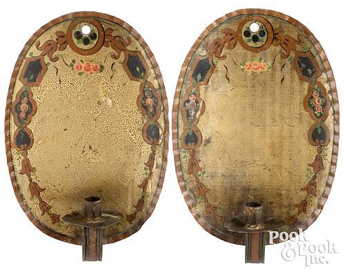 Rare pair of decorated oval tin sconces, 19th c.