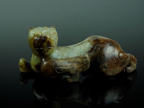 A Chinese Green and Brown Lion Jade