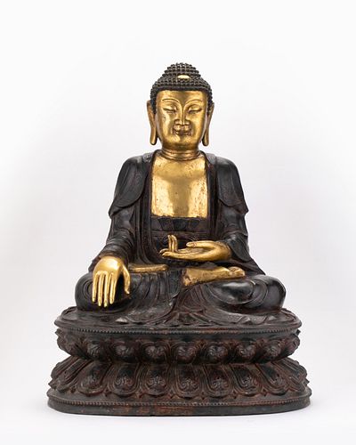 A parcel-gilt bronze figure of Buddha, Ming dynasty
