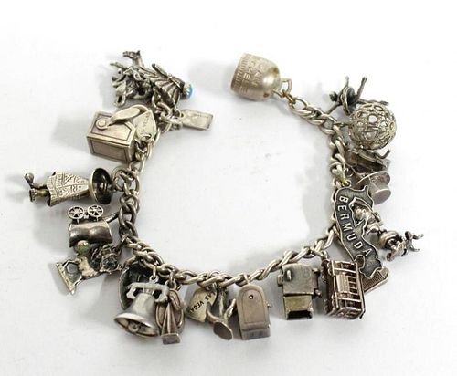 Sterling Silver Bracelet with 21 Assorted Charms