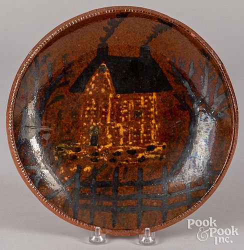 Russell Stahl redware plate with house decoration