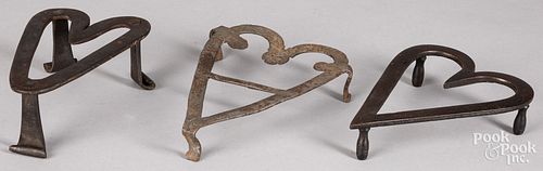 Three wrought iron heart trivets, 19th c.