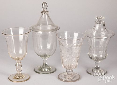Four colorless glass vases