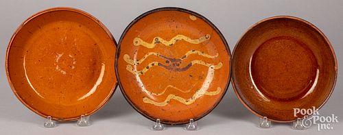 Three Pennsylvania redware shallow bowls, 19th c.