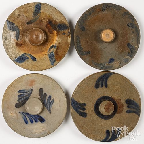 Four stoneware crock lids, 19th c.