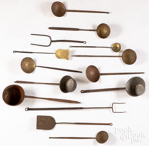 Fourteen long handled iron utensils, 19th c.
