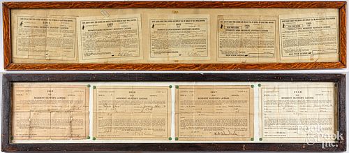 Nine framed Pennsylvania hunting license papers