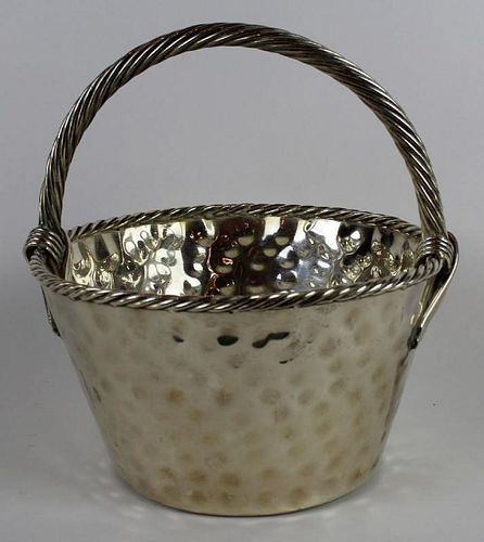 Hand hammered basket with handle