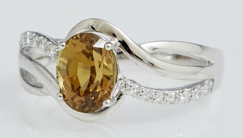 Lady's Platinum Dinner Ring, with an oval 2.02 car