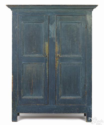Painted pine wall cupboard, early 19th c., retaining an old scrubbed blue surface, 75 1/2'' h.