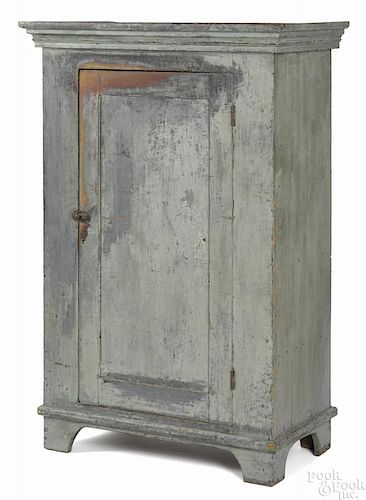 Painted pine wall cupboard, 19th c., retaining an old light green surface, 59 1/2'' h., 35 1/2'' w.
